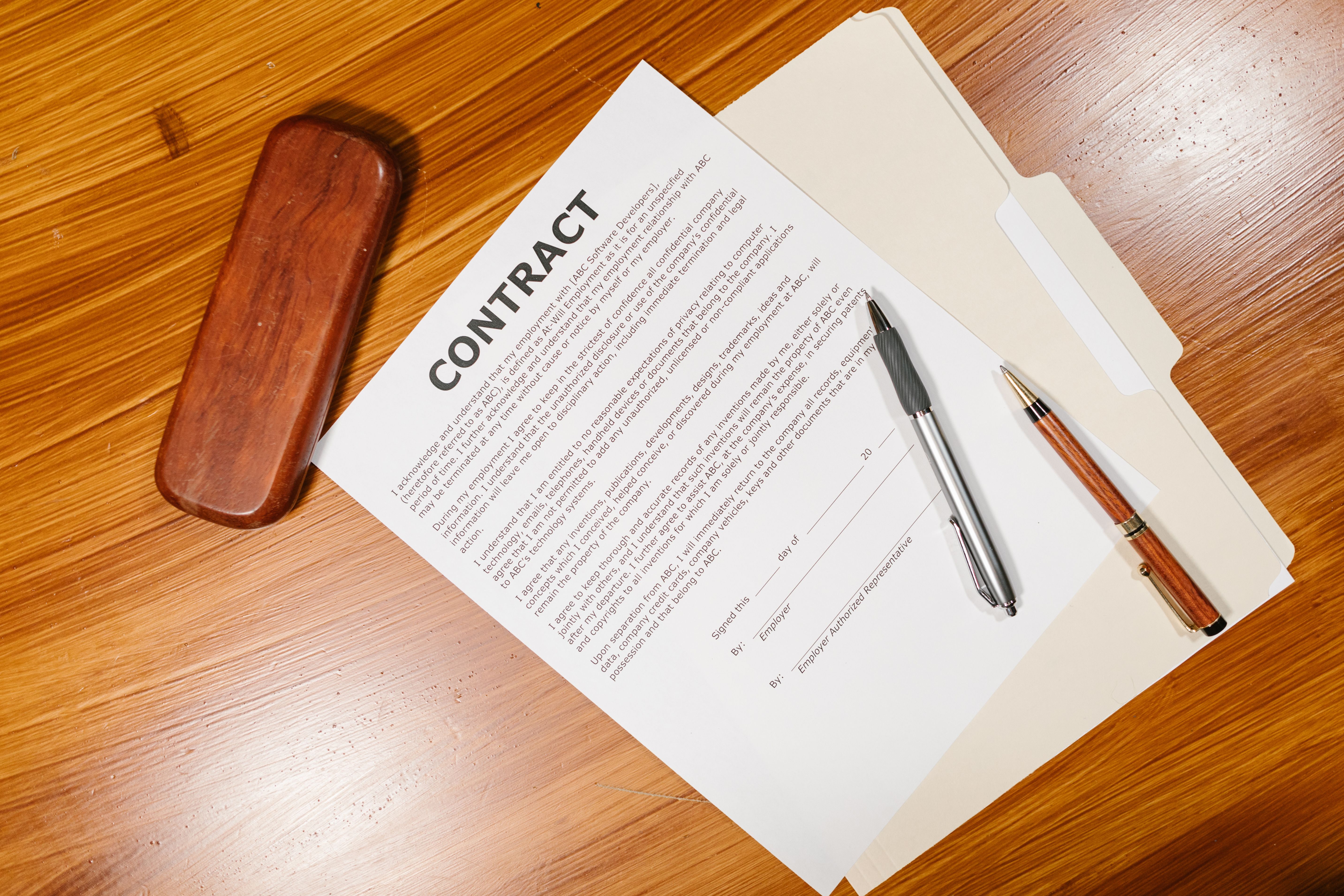 Legal documents and pens arranged on a desk for reviewing claim details
