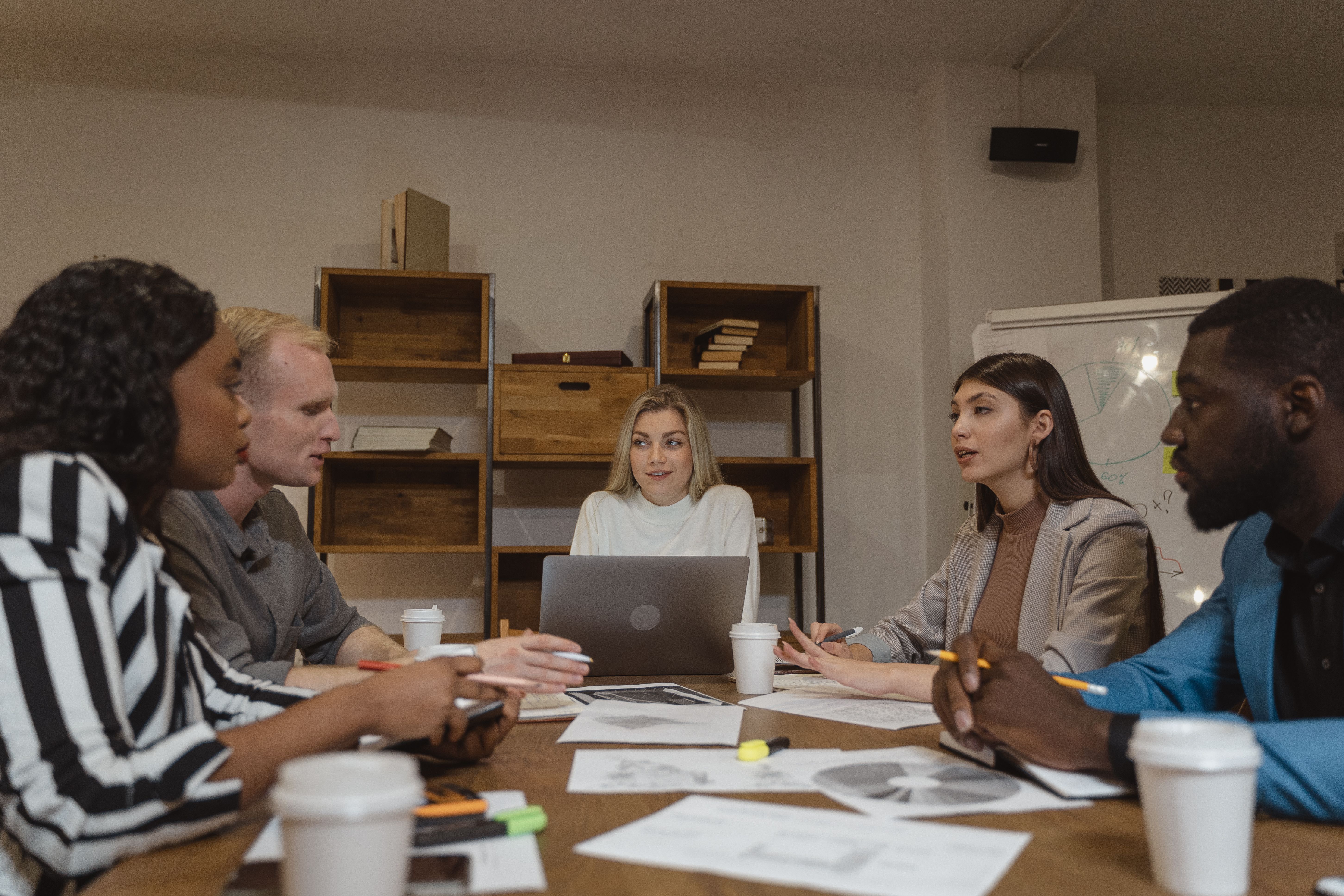 A group collaborating during a meeting about shared legal concerns